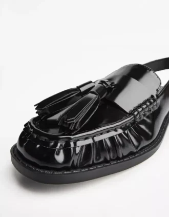 Mocassins à pompons sans talon